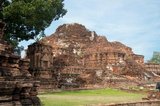 Wat Phra Mahathat was built during the reign of Borommaracha I (Boromma Rachathirat I) or Khun Luang Pa Ngua (1370- 1388), who was the third king of the Ayutthaya Kingdom.<br/><br/>


Ayutthaya (Ayudhya) was a Siamese kingdom that existed from 1351 to 1767. Ayutthaya was friendly towards foreign traders, including the Chinese, Vietnamese (Annamese), Indians, Japanese and Persians, and later the Portuguese, Spanish, Dutch and French, permitting them to set up villages outside the city walls. In the sixteenth century, it was described by foreign traders as one of the biggest and wealthiest cities in the East. The court of King Narai (1656–1688) had strong links with that of King Louis XIV of France, whose ambassadors compared the city in size and wealth to Paris.